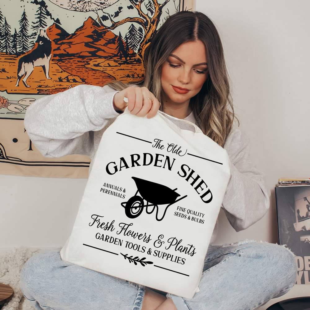 The Olde Garden Shed with wheel barrow canvas tote bag