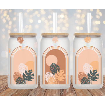Boho style Monstera leaves on a can shaped glass